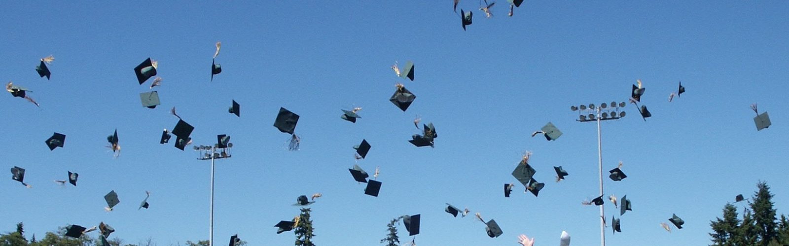 graduation caps being thrown